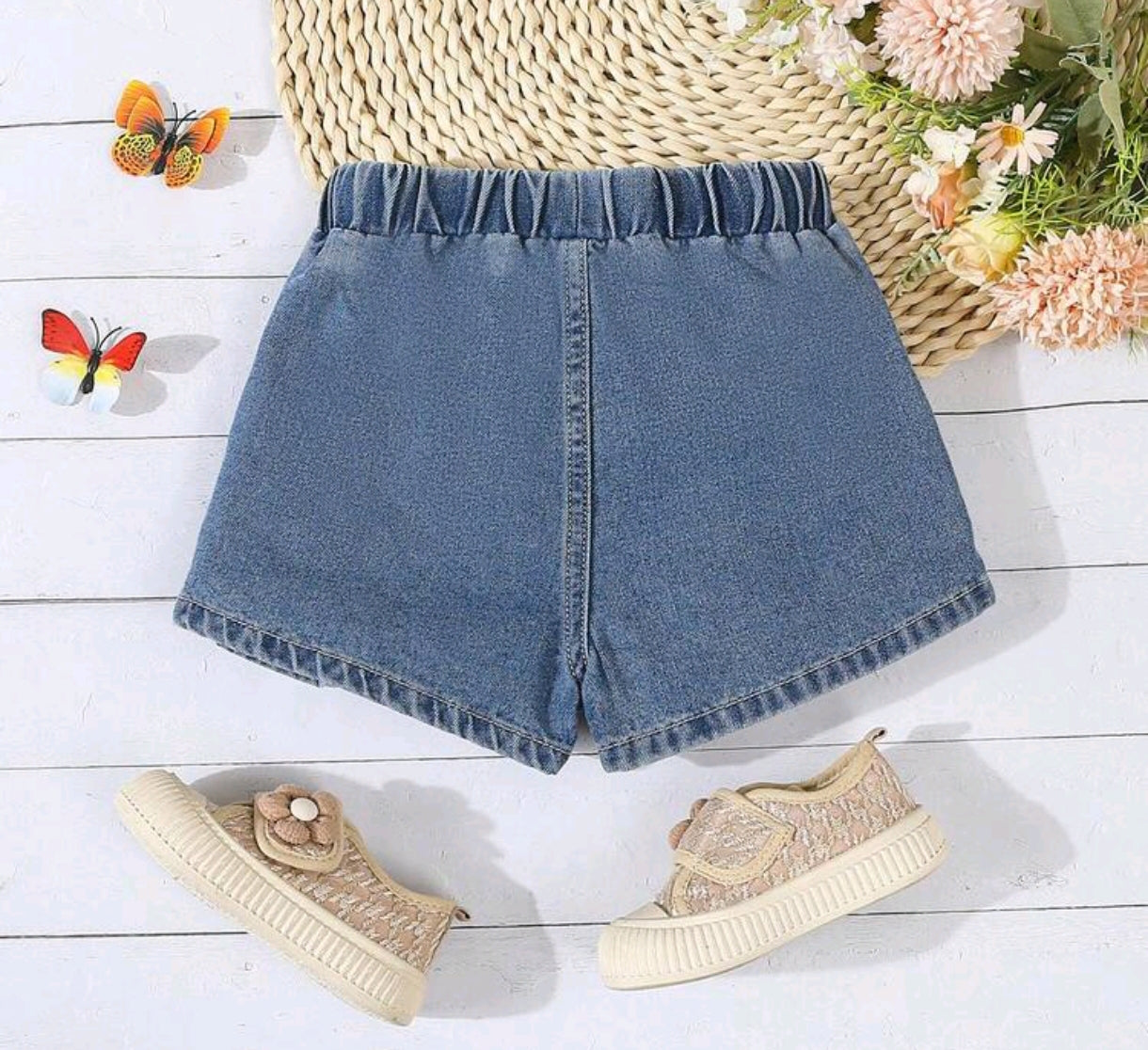 Short Pollera de Jeans plisado y con detalles enoños