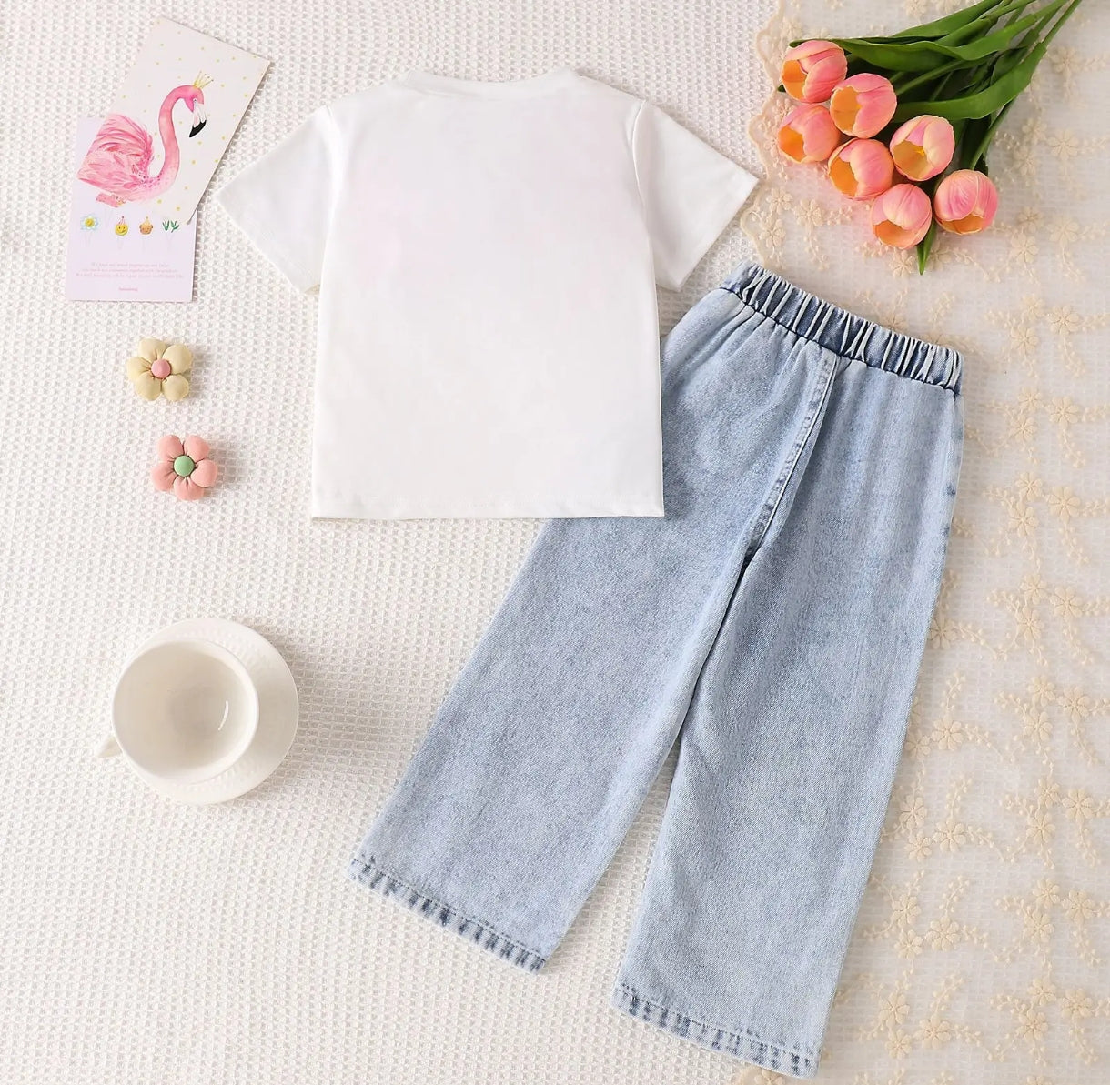 Blusa con lazo + pantalón de jeans con brillos
