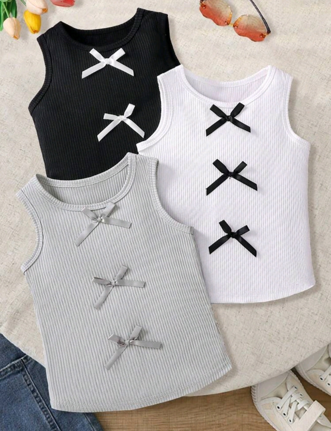 Blusita sin mangas con moños