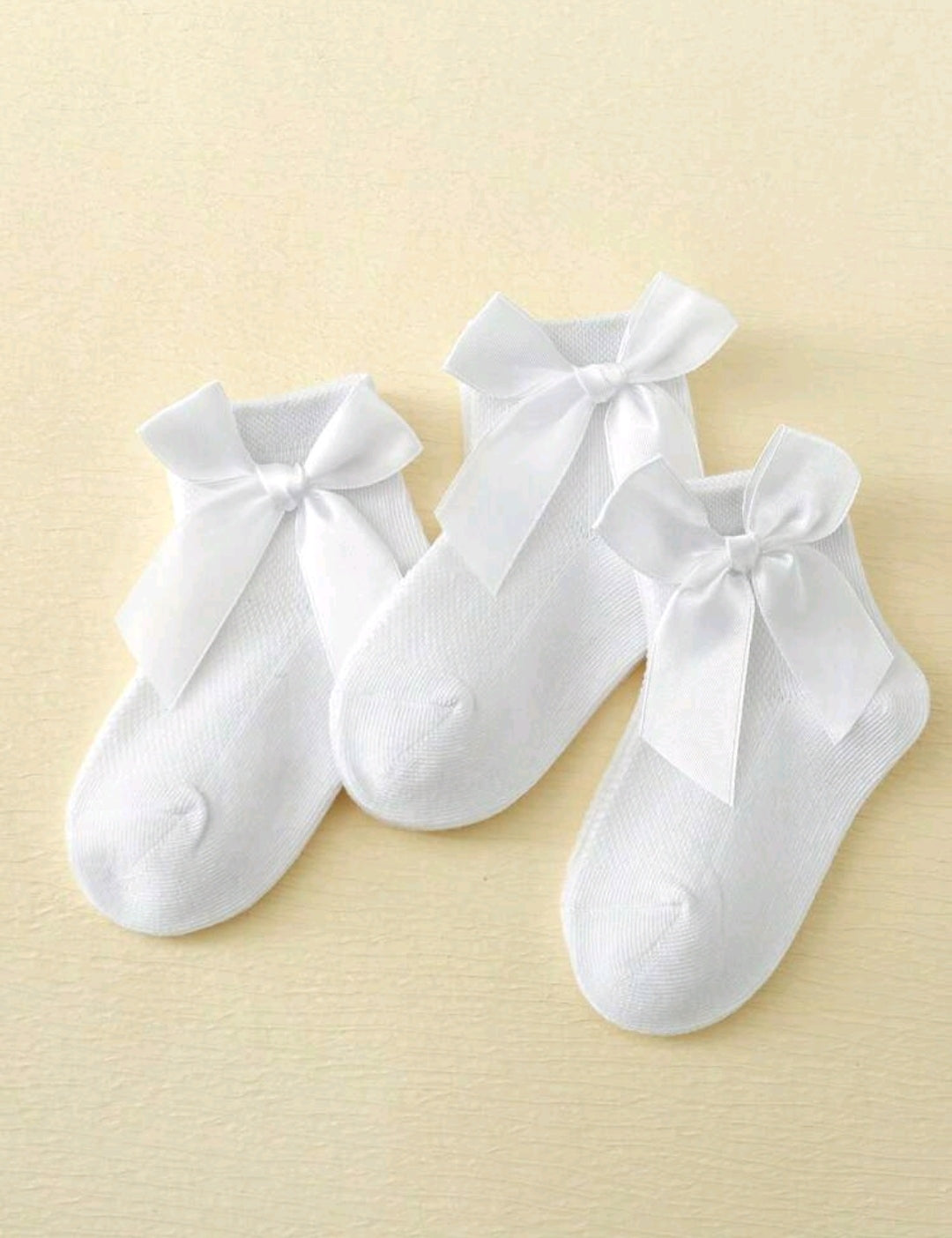 Acc. Media corta con moño