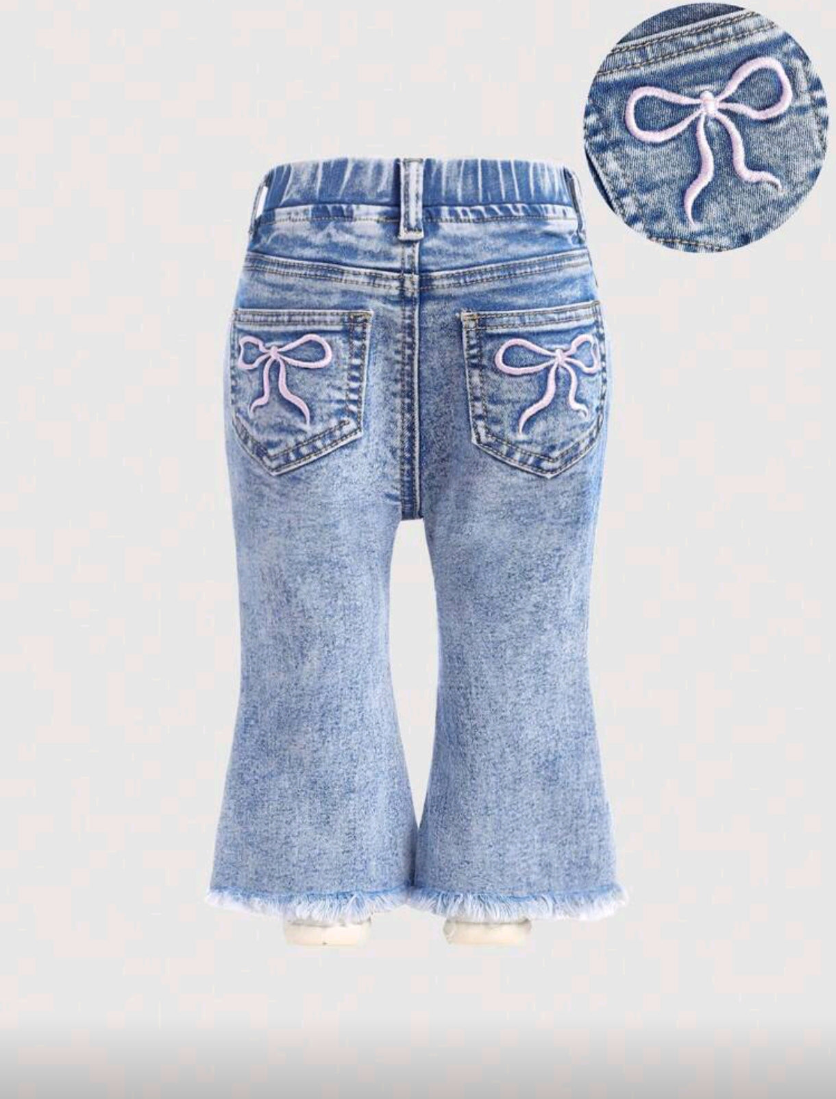 Pantalón de jeans para bebé con bordados de moño