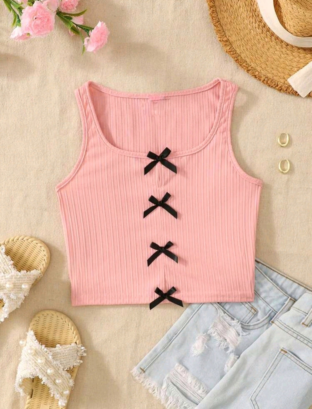 Blusa sin mangas con detalles en moño