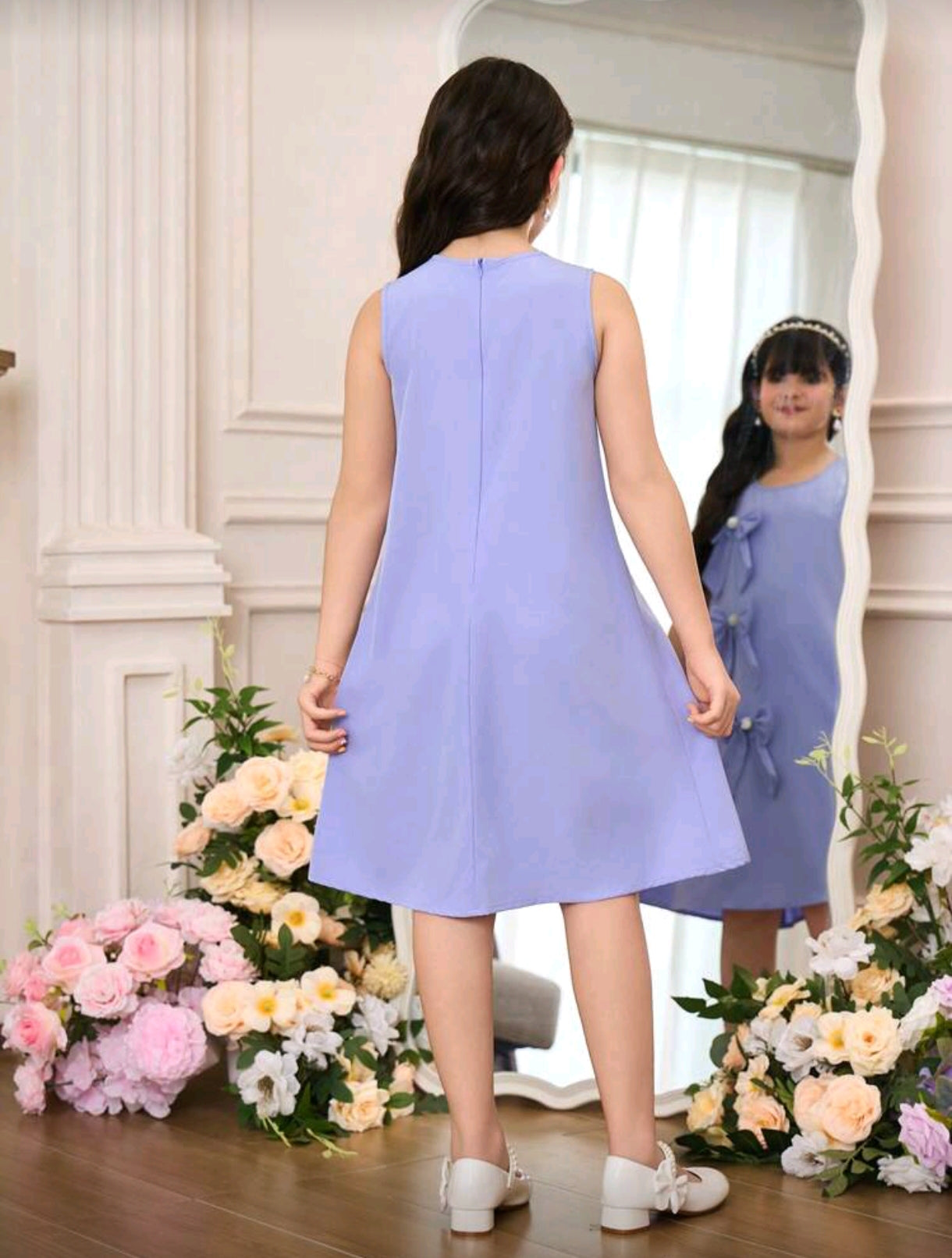 Vestido sin mangas con detalles en moños 3D