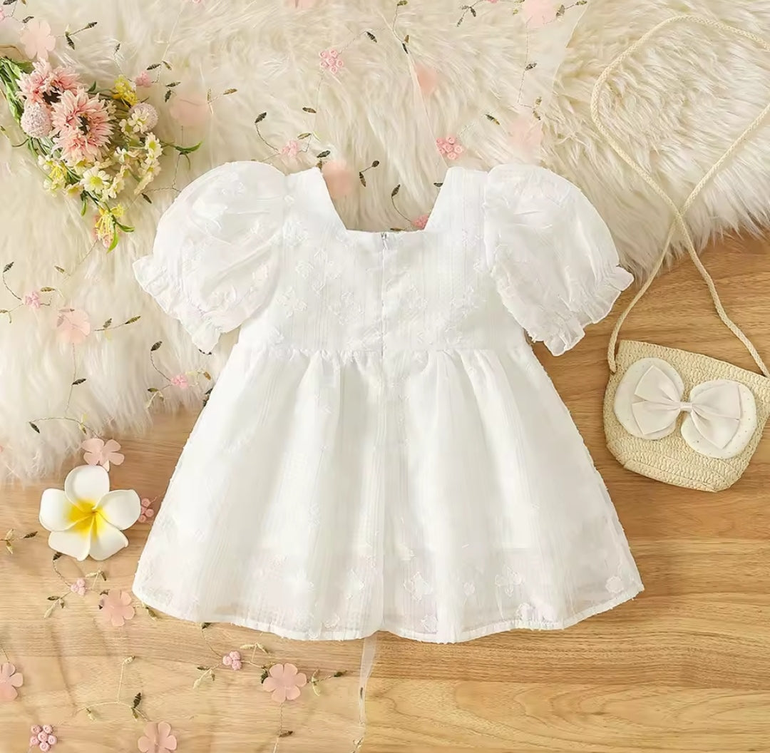 Vestido bebé blanco con bolsito