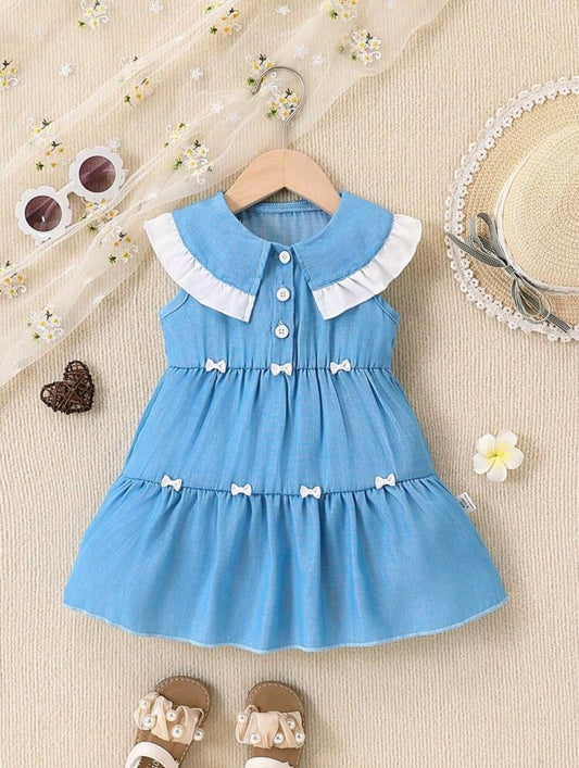 Vestido bebé con detalles en moñitos