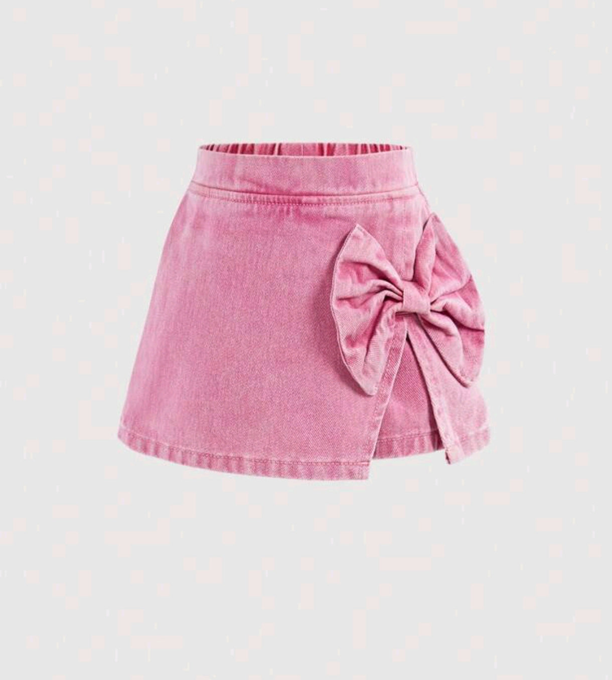 Short pollera de Jeans rosa, con moño lateral
