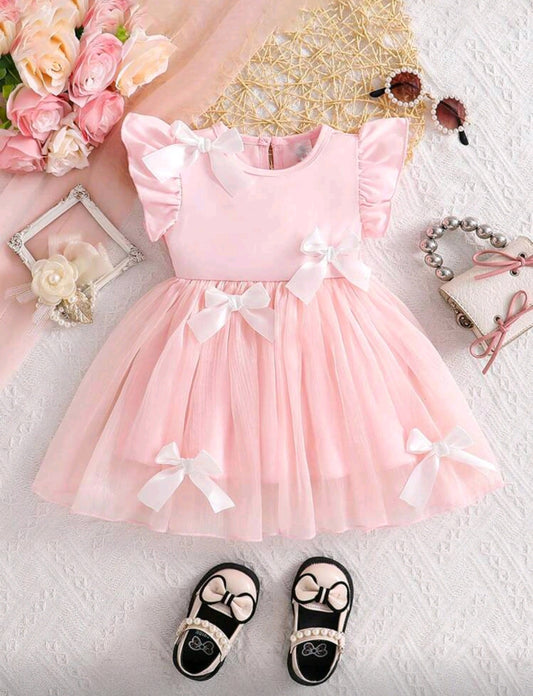 Vestido elegante con detalles en moños