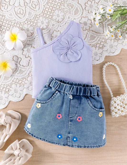 Blusa asimétrica + falda de jeans con diseño