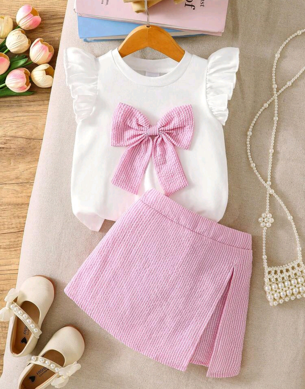 Blusa con moño frontal + short pollera a rayas