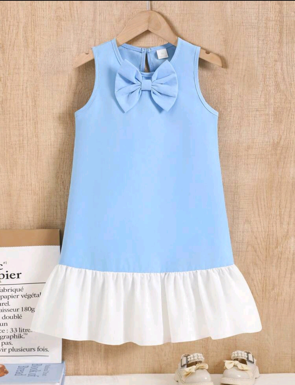 Vestido corte A, sin mangas y lazo delantero