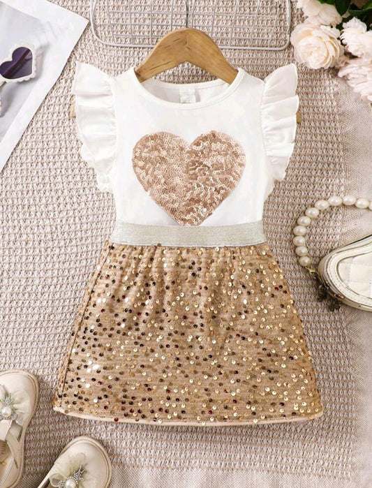 Blusa con detalles en corazón + falda con lentejuelas