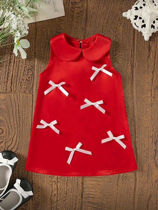 Vestido elegante sin mangas con detalles en moños