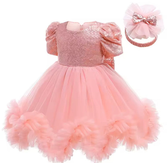 Vestido elegante con lentejuelas y moño