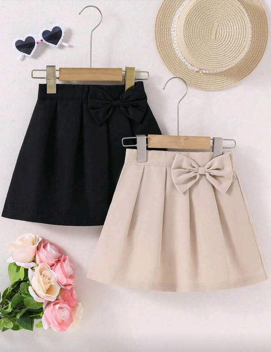 Falda plisada con moño