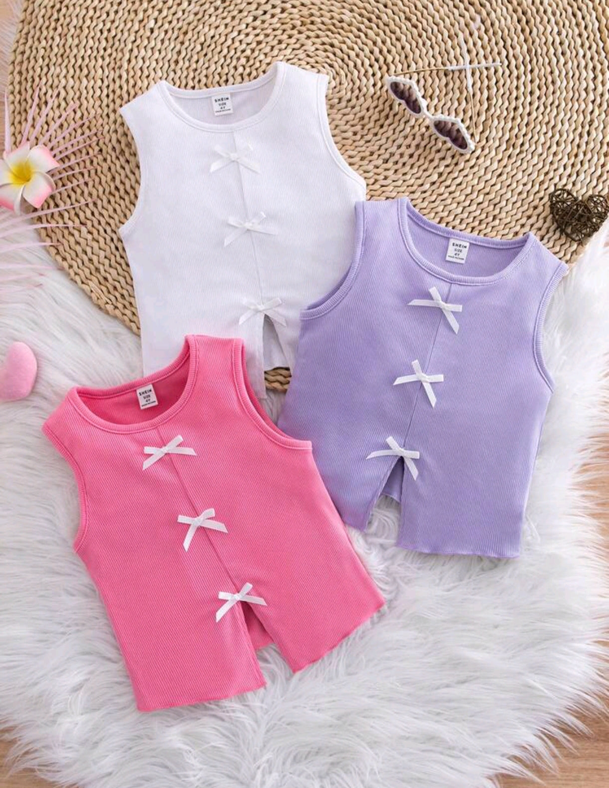 Blusa sin mangas acanalada con detalles en moños