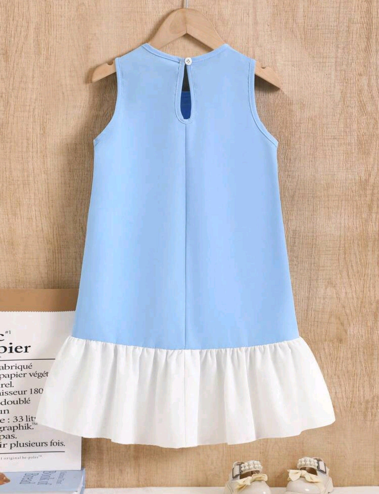 Vestido corte A, sin mangas y lazo delantero