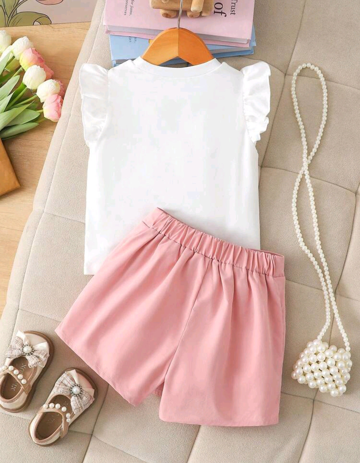 Blusa con detalles en moño+ short pollera con detalles en perlitas