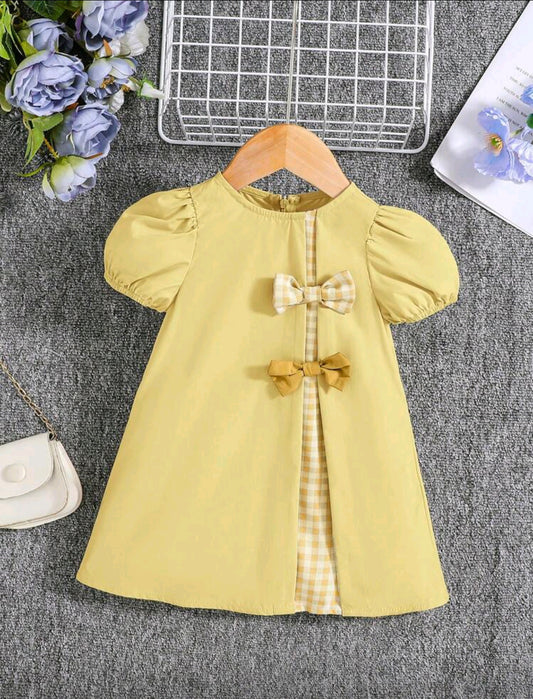 Vestido bebé con mangas farol y moños