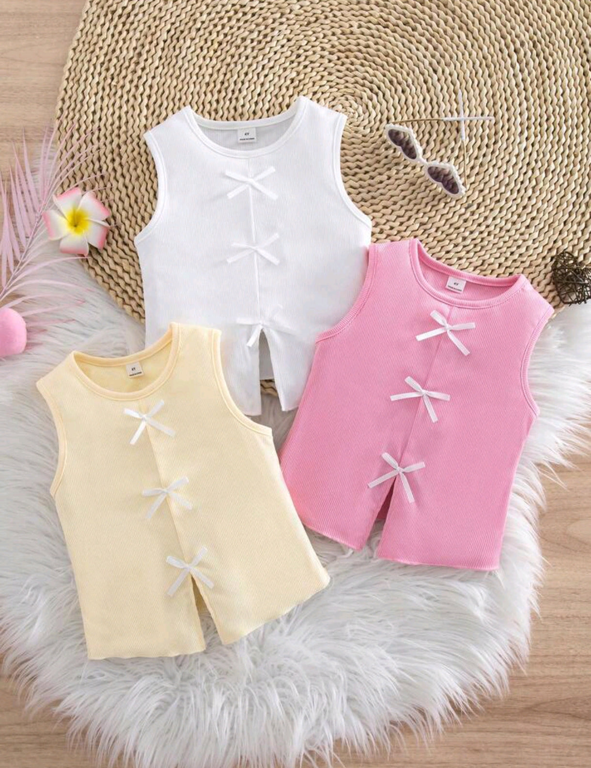 Blusa sin mangas acanalada con detalles en moños