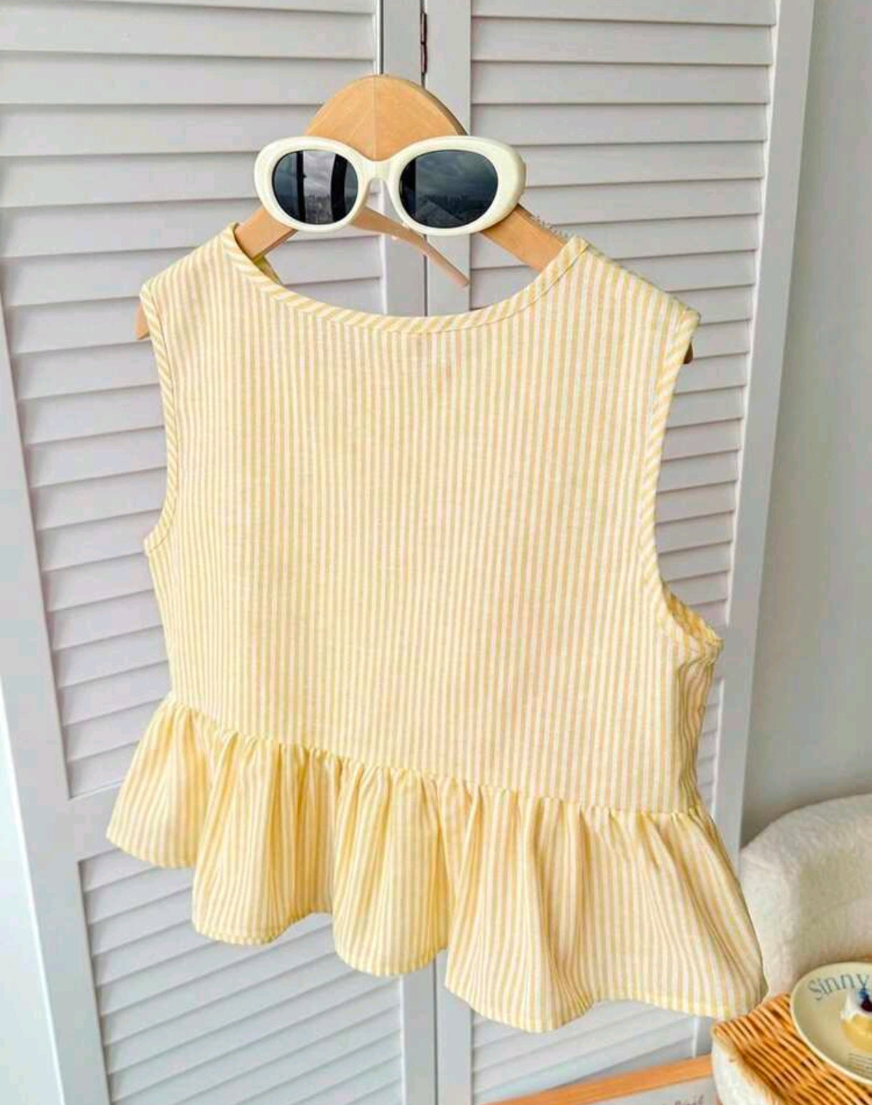Blusa maarilla sin mangas a rayas con moños