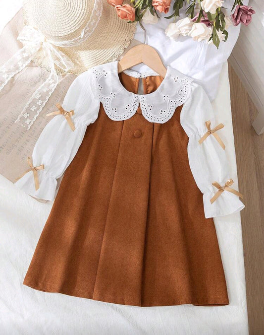 Vestido de corderoy con detalles de moños en las mangas