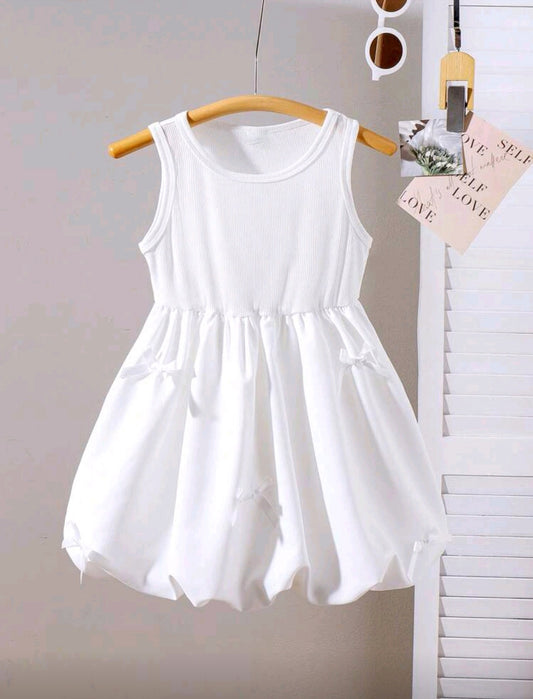 Vestido blanco globo con detelles de moños 3D