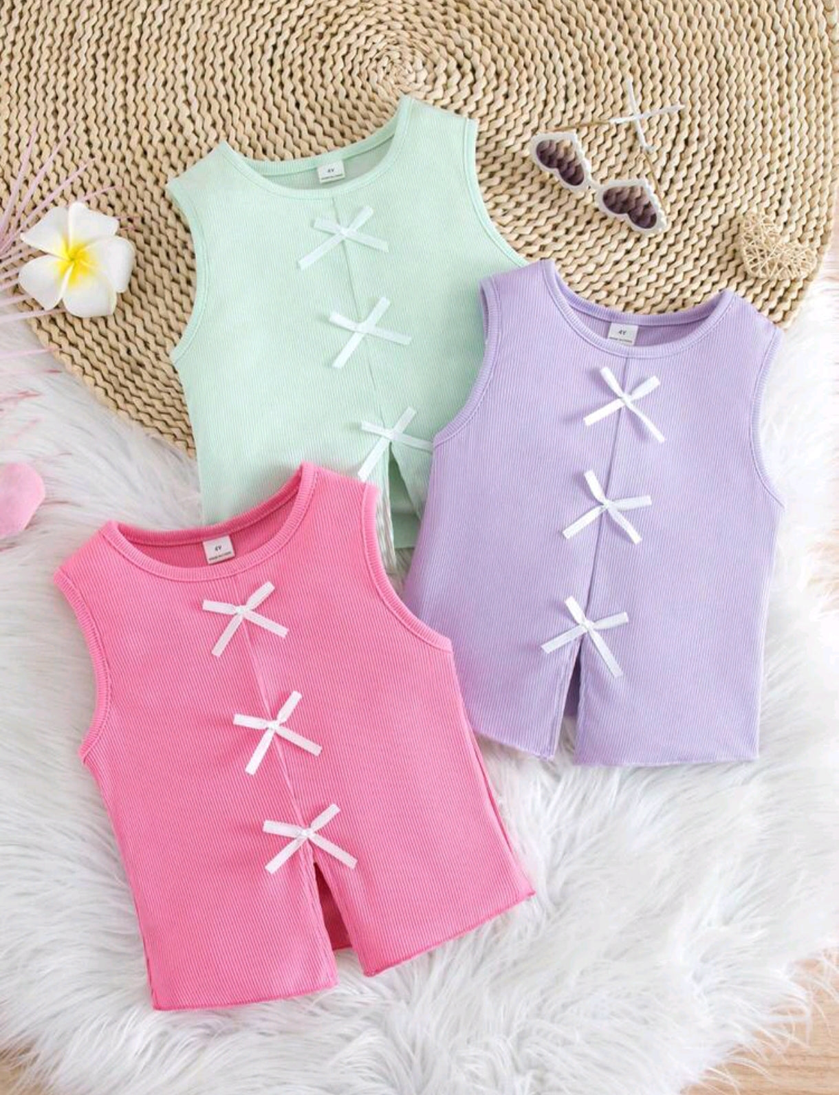 Blusa sin mangas acanalada con detalles en moños