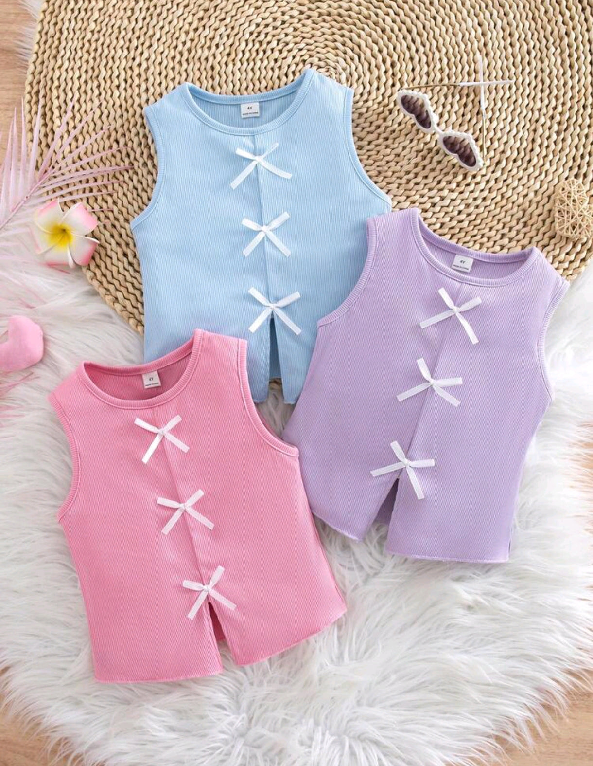 Blusa sin mangas acanalada con detalles en moños