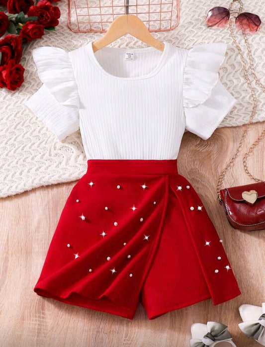 Blusa acanalada + short pollera con detalles en perlitas