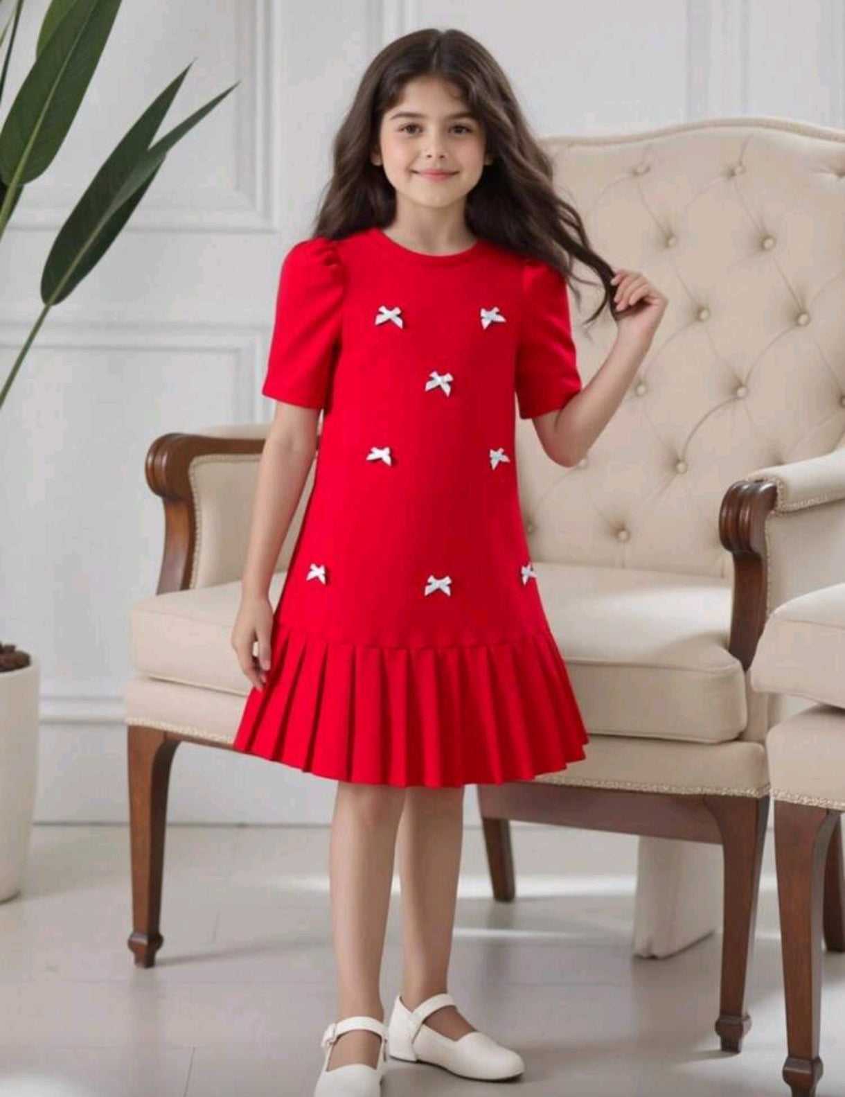 Vestido plisado con detalles en moño 3D