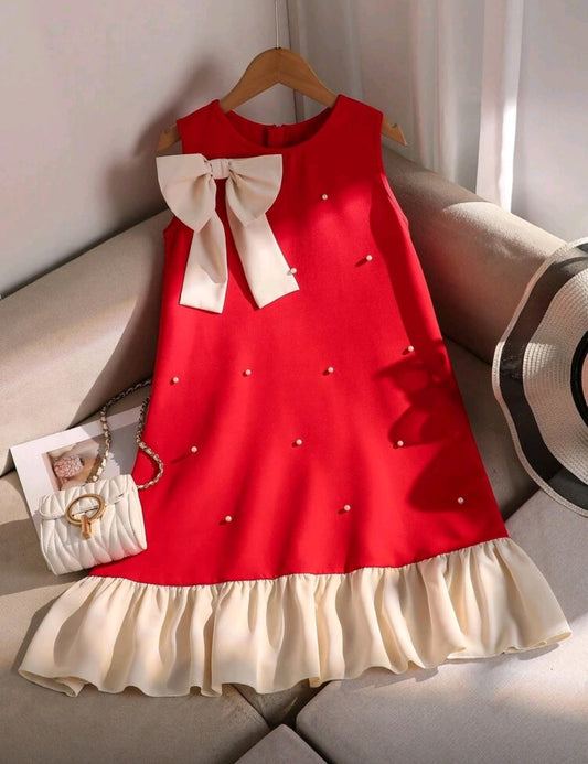 Vestido chic con detalles en perlitas y moño