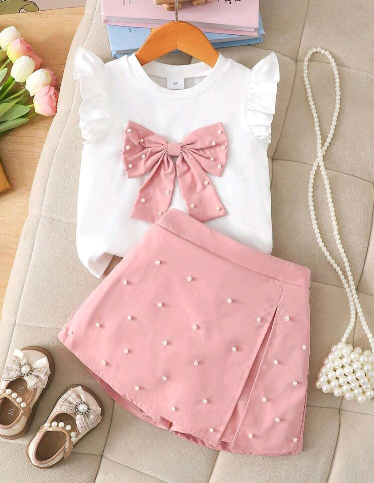 Blusa con detalles en moño+ short pollera con detalles en perlitas