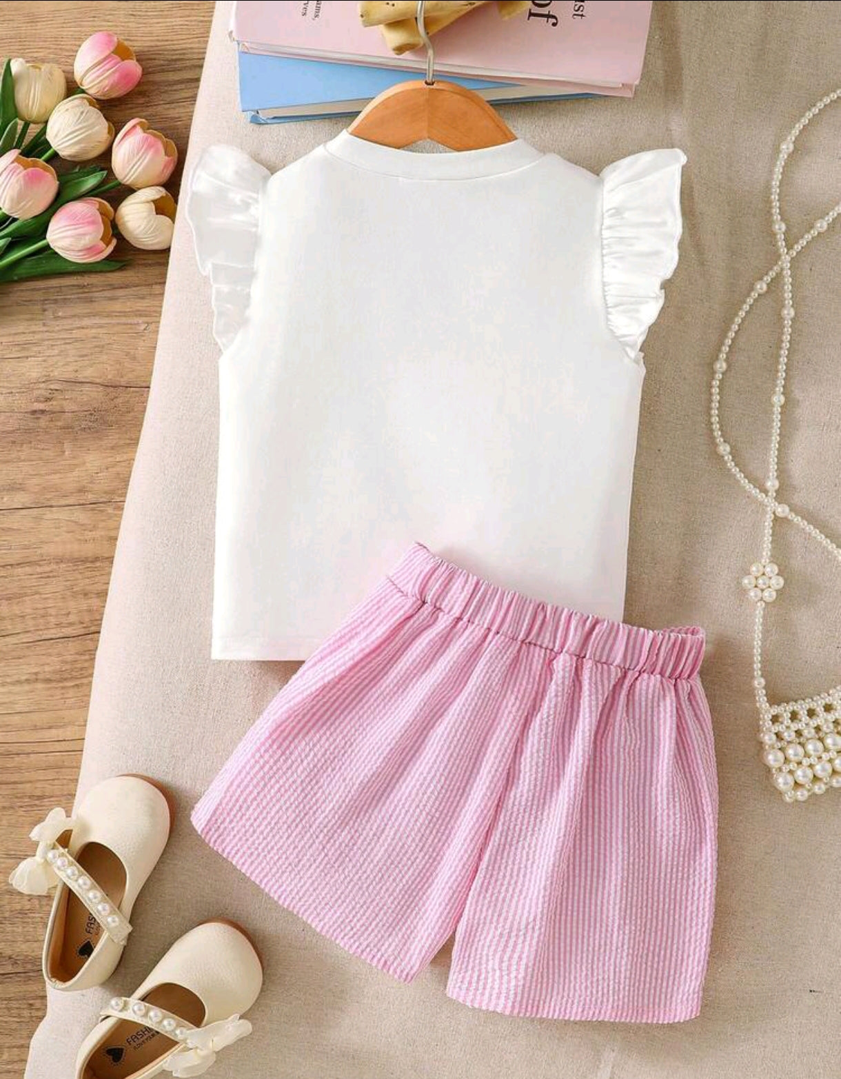 Blusa con moño frontal + short pollera a rayas
