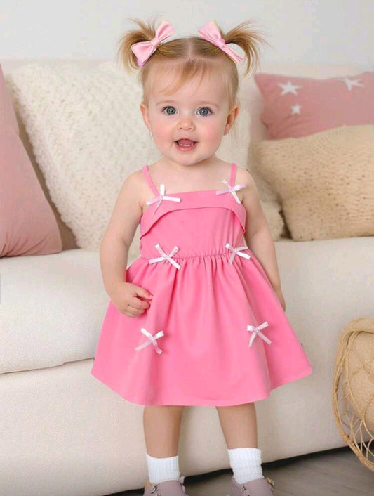 Vestido bebe de tiritas y detalles en moño