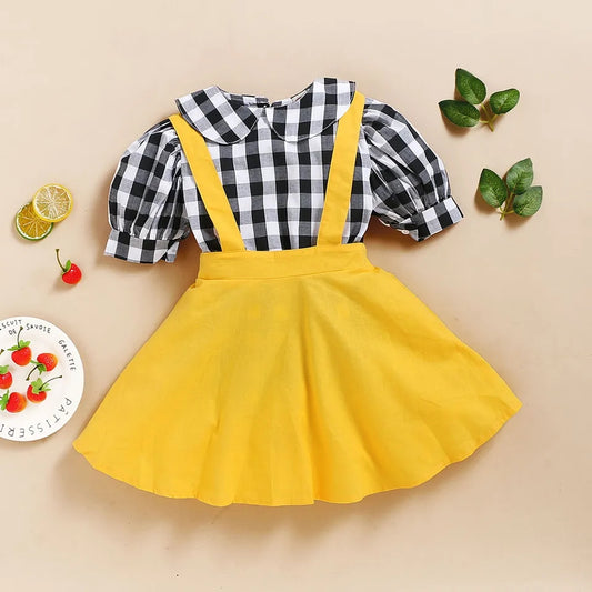 Conjunto niña camisa a cuadro+ falda con tiras